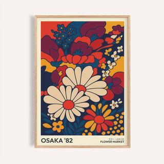 Retro wall art prints featuring an illustration of daisies in bold reds navy and ochre with text below
