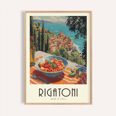 Framed close-up of pasta artwork featuring rigatoni in a bowl with seaside village background