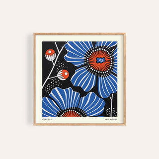 Framed Flowers Prints showing blue poppy flowers with red centres in a minimalist illustration style
