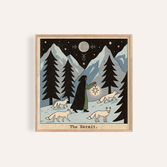Framed print of The Hermit Tarot Card Art showing a hermit with a lantern and foxes against a mountain backdrop