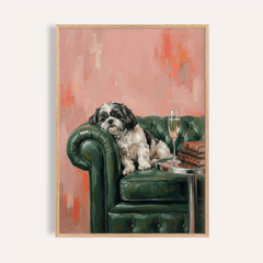 Framed Shih Tzu dog print showing a black and white dog on a green armchair with a pink background