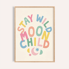 Close-up of Moon Child wall art with colourful typography and moon and stars in a wooden frame