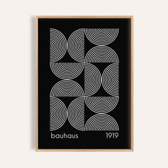 Framed Geometric Wall Art with white concentric circles on a black background in a minimalist style