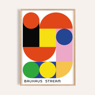 Framed print of geometric wall decal with red, yellow, blue and green shapes and bauhaus style text