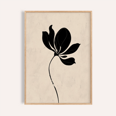 Black flower art showing a minimalist black floral silhouette in a wooden frame