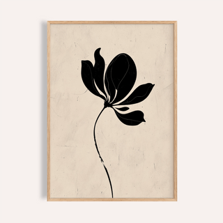 Black flower art showing a minimalist black floral silhouette in a wooden frame