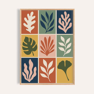Cut out print of nine leaf tiles shown on a plain warm wall