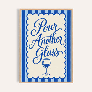 Pour Another Glass print reading Pour Another Glass in blue script above a wine glass