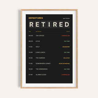 Departures board retirement print shown on a plain warm cream wall