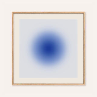 Cobalt blue wall art with a glowing cobalt orb on a pale ice blue square