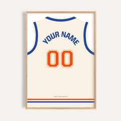Framed basketball jersey poster in cream with an orange number and blue text