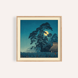 Framed Hasui Kawase Moon Print of a pine tree and full moon in blue and yellow tones