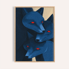 Framed print close-up of blue fox prints with three stylised red-eyed fox heads in blue and dark tones