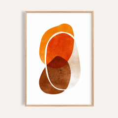 Framed print close-up of orange shapes art print with overlapping earthy tones and white outline