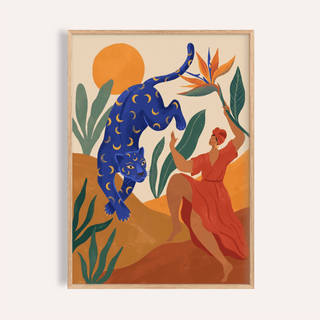 Close-up of mystical blue leopard wall art with moon patterns and a dancing woman in red