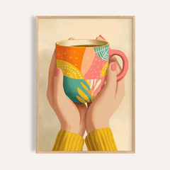 Framed Coffee Mug Art showing hands with pink nails holding a colourful patterned mug