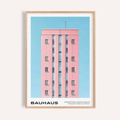 Framed print of a pink building facade with minimalist photographic style against a blue sky