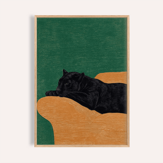 Framed print of Big Cat Art Print showing a black panther lying on an orange surface with a green background