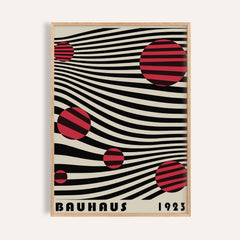 Framed close-up of Large Bauhaus Wall Art with red striped circles on black wavy lines