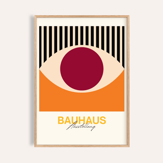 Framed Retro Eye wall art with a stylised eye in orange, cream and dark red and black vertical stripes