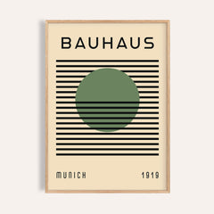 Framed Bauhaus art poster with a green circle and black lines on cream background