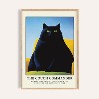 Cat Funny Poster framed print of a black cat with green eyes on a yellow couch