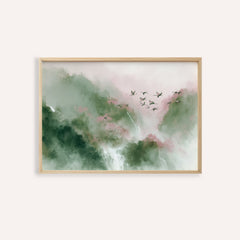 Watercolor Bird Print with flying birds over misty green and pink mountains framed in light wood