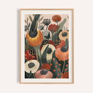 Framed burnt orange wall art showing abstract orange and cream flowers with green leaves