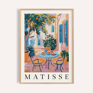 Wall Art Mediterranean framed print of a citrus tree patio scene with blue shutters and a round table
