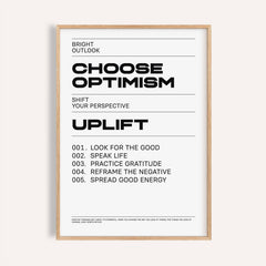 Framed uplifting wall art with black typographic motivational text on a white background