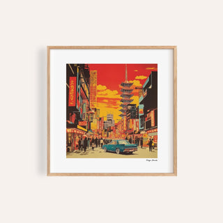 Framed Japonise Art of a Tokyo street scene in red and yellow tones with a blue car