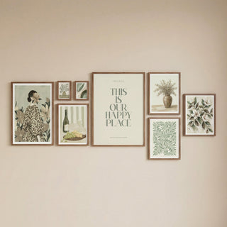 Dining room gallery set with botanical illustrations and typography in muted green and beige tones on a beige wall