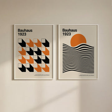 Bauhaus gallery wall art of geometric shapes in orange black and cream on a plain wall