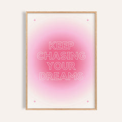 Framed print of motivational text with pink gradient and star details