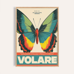Framed close-up of large butterfly wall art with green yellow and red on cream background
