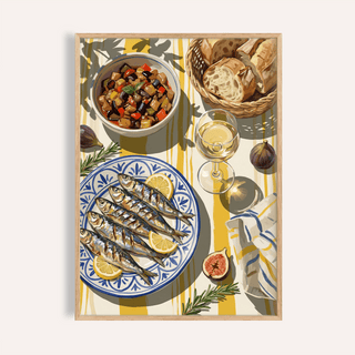 Framed Mediterranean Kitchen Decor featuring grilled sardines with lemon on a blue patterned plate and a basket of bread