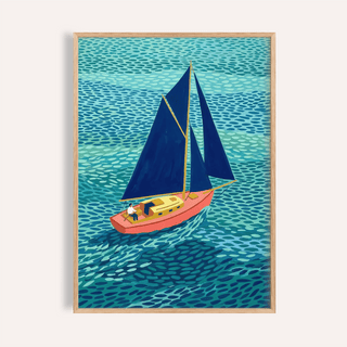 Framed print of a sailboat illustration with dark blue sails and a coral hull on textured blue water