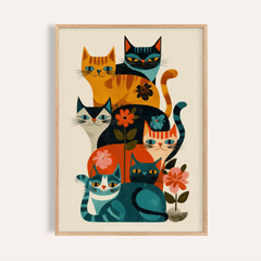 Framed print of a group of retro cats in orange, blue, and black with floral details