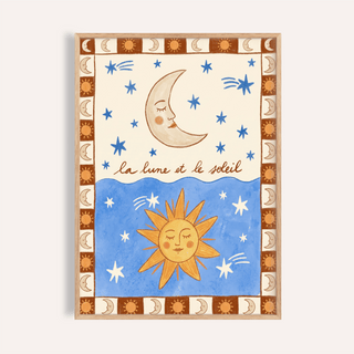 Framed Moon And Sun Print with blue stars and brown border on beige wall