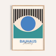 Framed Abstract Eye Print with blue, green and black eye graphic in a natural wood frame
