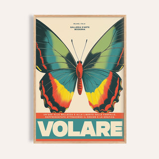 Framed close-up of large butterfly wall art with green yellow and red on cream background