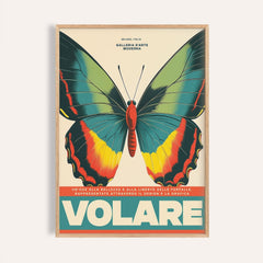 Framed close-up of large butterfly wall art with green yellow and red on cream background