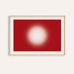 Red abstract wall art with a glowing cream orb on a deep cherry red ground