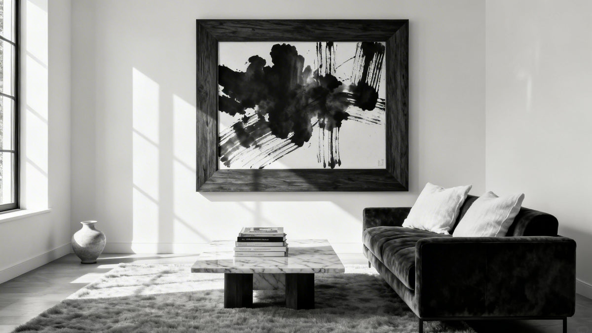 Framed wall art mockup in a stylish black and white living room, showcasing timeless monochrome design.