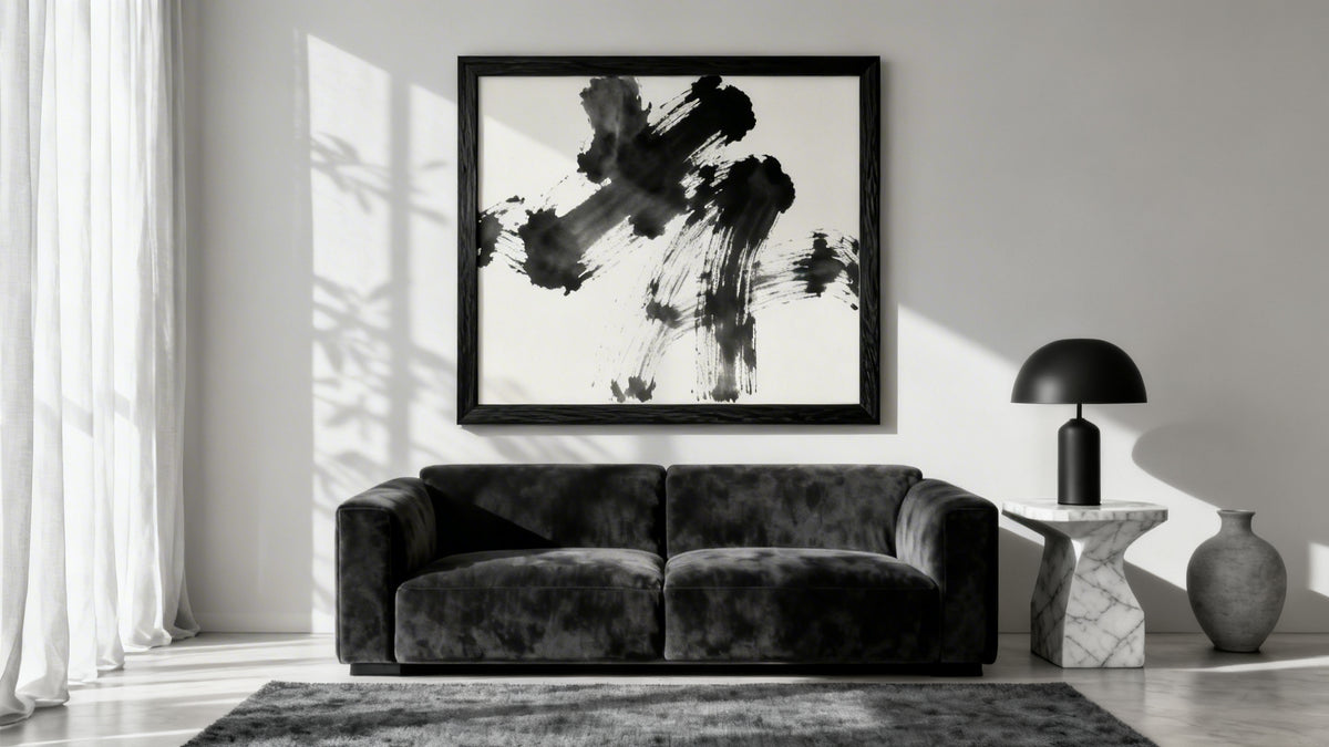Framed wall art in a chic black and white living room, showcasing timeless monochrome design elements.