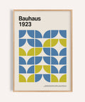 Modern office wall decor in blue and lime with Bauhaus shapes