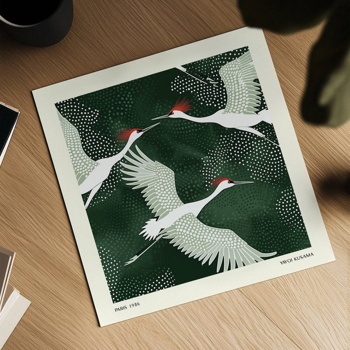 White Crane Birds Art detailed close-up of three white cranes with red accents on a dark green dotted background on a wood surface