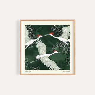 Framed White Crane Birds Art showing white cranes with red crowns on a dark green background