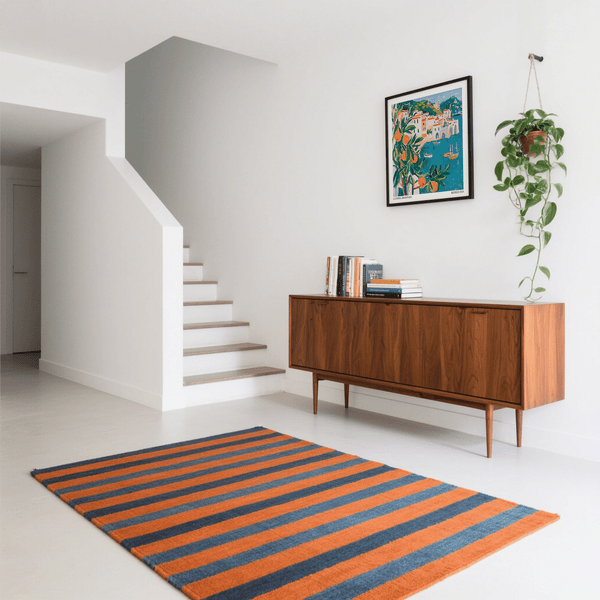 Modern Amalfi Coast Print in minimalist entrance hallyway above sideboard