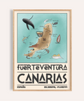 Canary Islands Wall Art poster above sofa showing illustrated map of Fuerteventura with labeled beaches and icons
